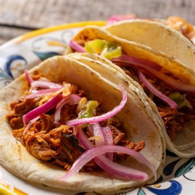  Cochinita Pibil: 一道以慢燉的豬肉和酸橙汁為主的尤卡坦美食！